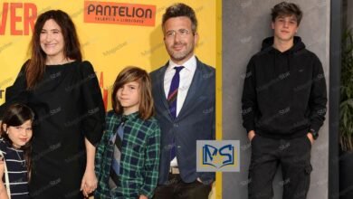 Kathryn Hahn and Ethan Sandler with their son Leonard Sandler at a red carpet movie premiere.