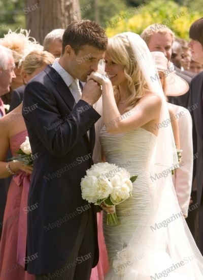 Lisa Roughead and Michael Carrick during their wedding ceremony, with the former Manchester United midfielder kissing his bride’s hand.